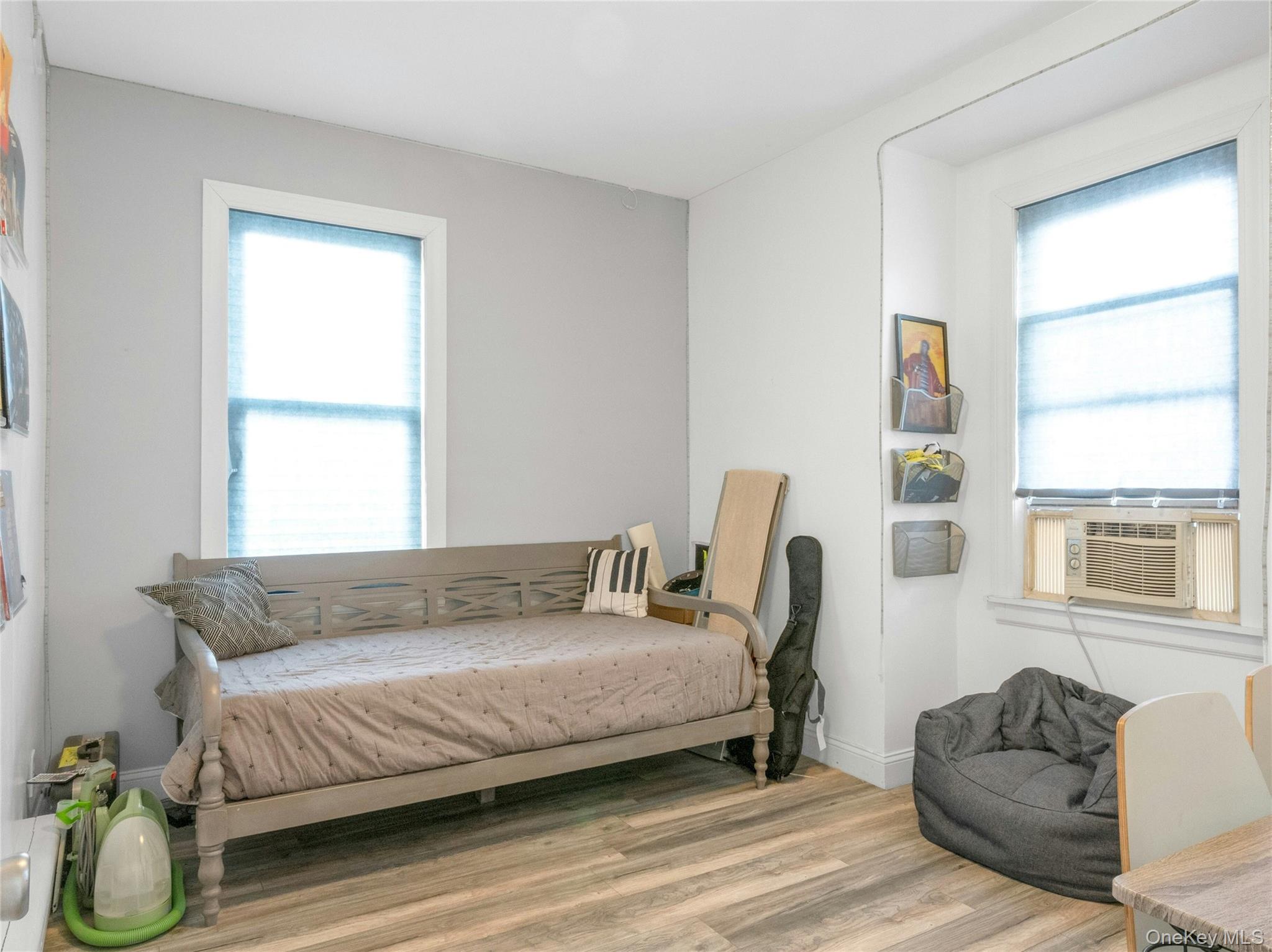 46 Meadow Lane New Rochelle, NY 10805 - Photo 23 of 42 a bedroom with a bed couch and window