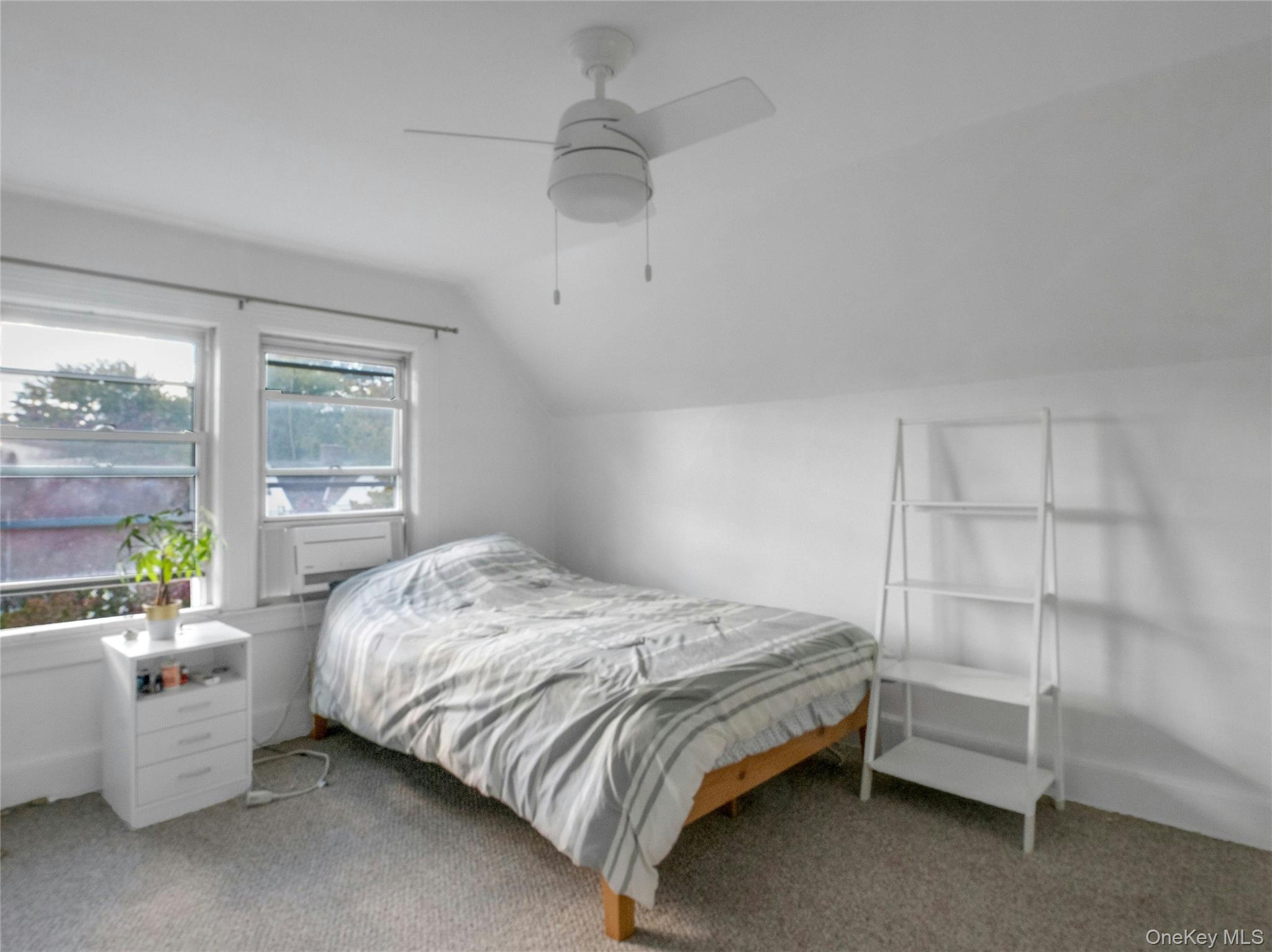 46 Meadow Lane New Rochelle, NY 10805 - Photo 25 of 42 a bedroom with a bed and a window