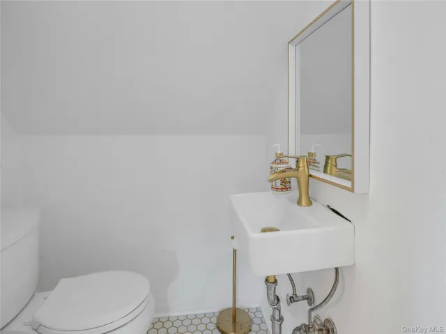 a view of staircase and kitchen view