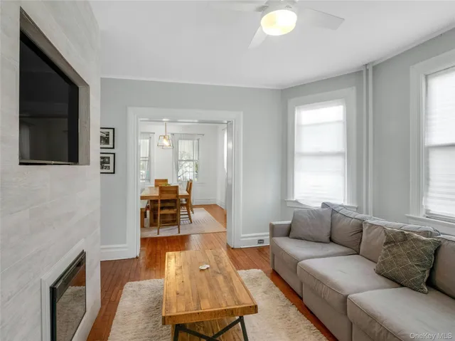 a view of a dining room with furniture and a chandelier