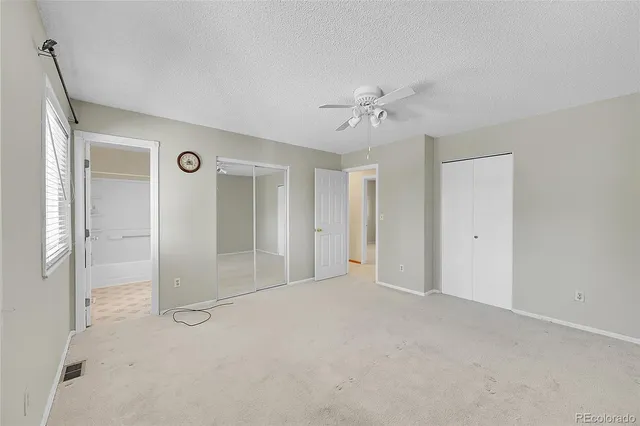 a view of empty room with fan