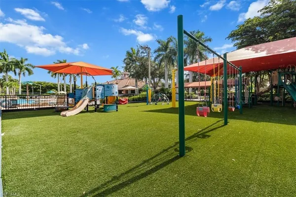 a backyard of a house with lots of green space and trees