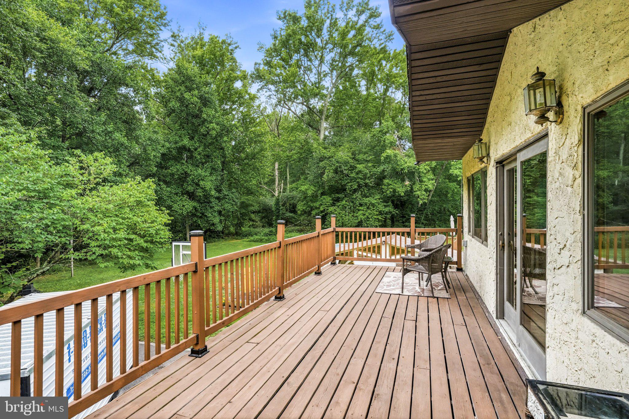 97 Skeet Road Medford, NJ 08055 - Photo 19 of 41 Serene deck overlooking lush greenery.