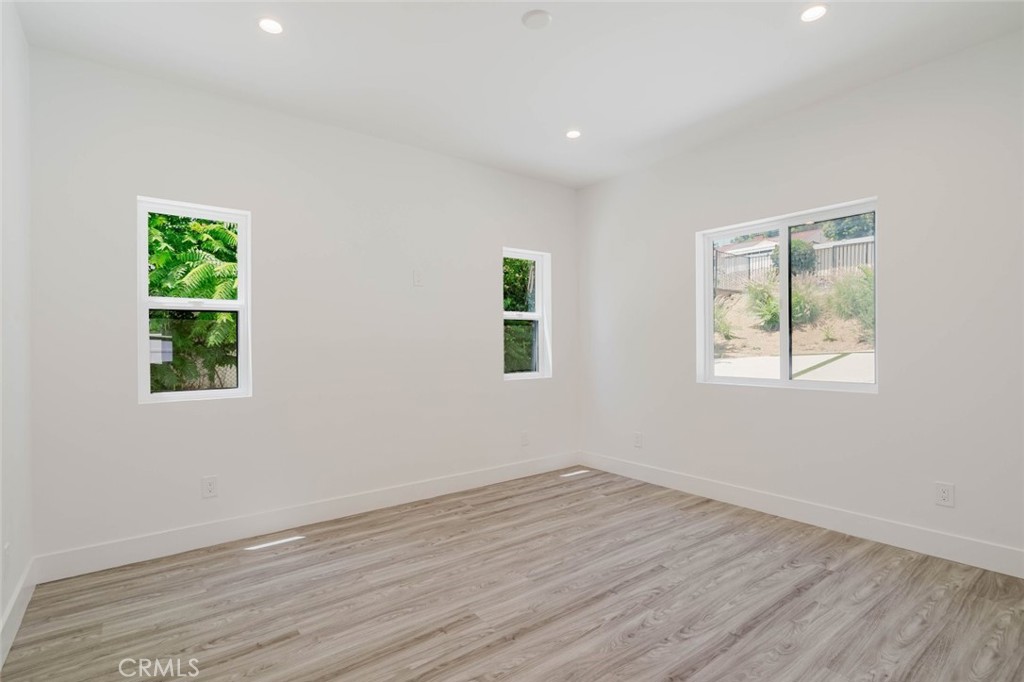 17846 Rinaldi Street Granada Hills, CA 91344 - Photo 20 of 34 a view of empty room with wooden floor and fan