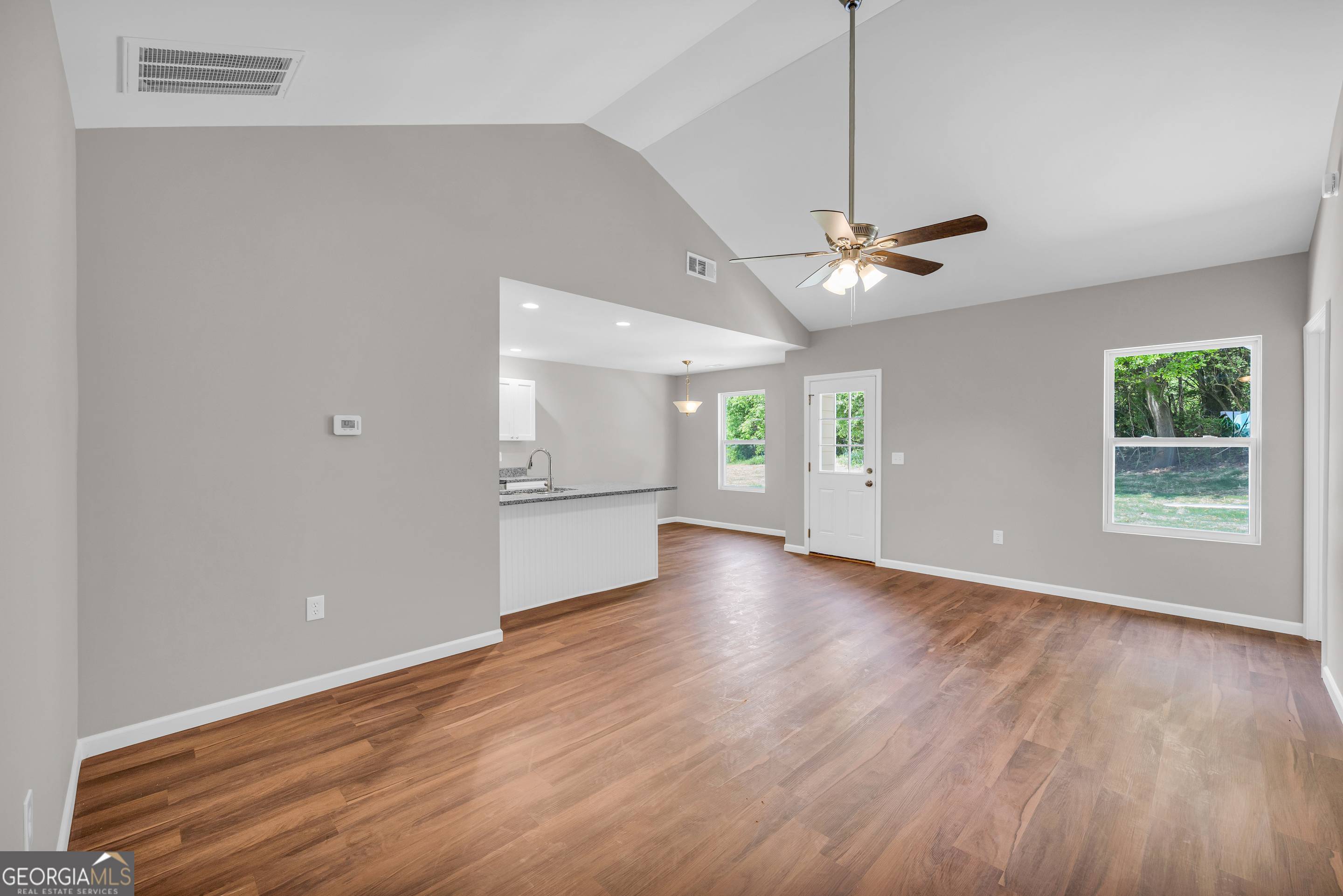 143 ADALINE Court Carnesville, GA 30521 - Photo 11 of 19 a view of an empty room with window and wooden floor