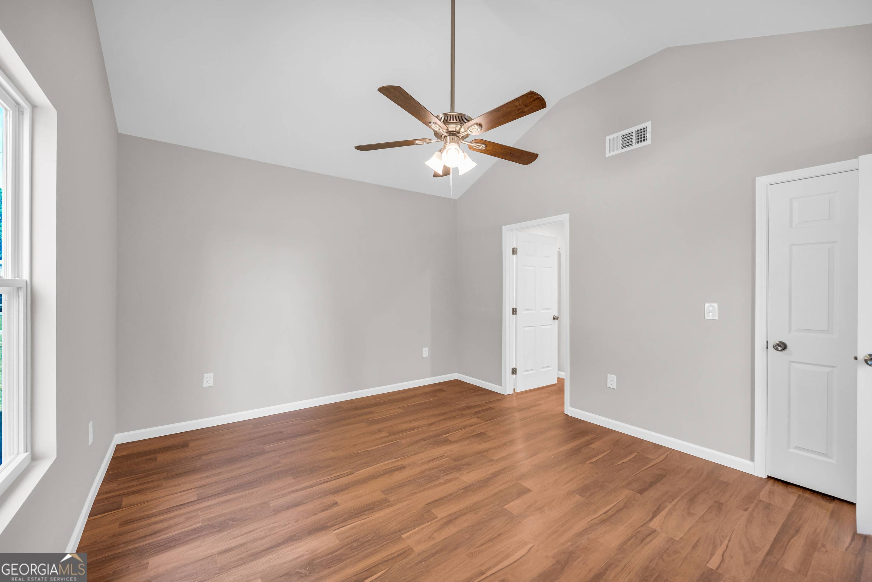 143 ADALINE Court Carnesville, GA 30521 - Photo 15 of 19 an empty room with wooden floor and windows
