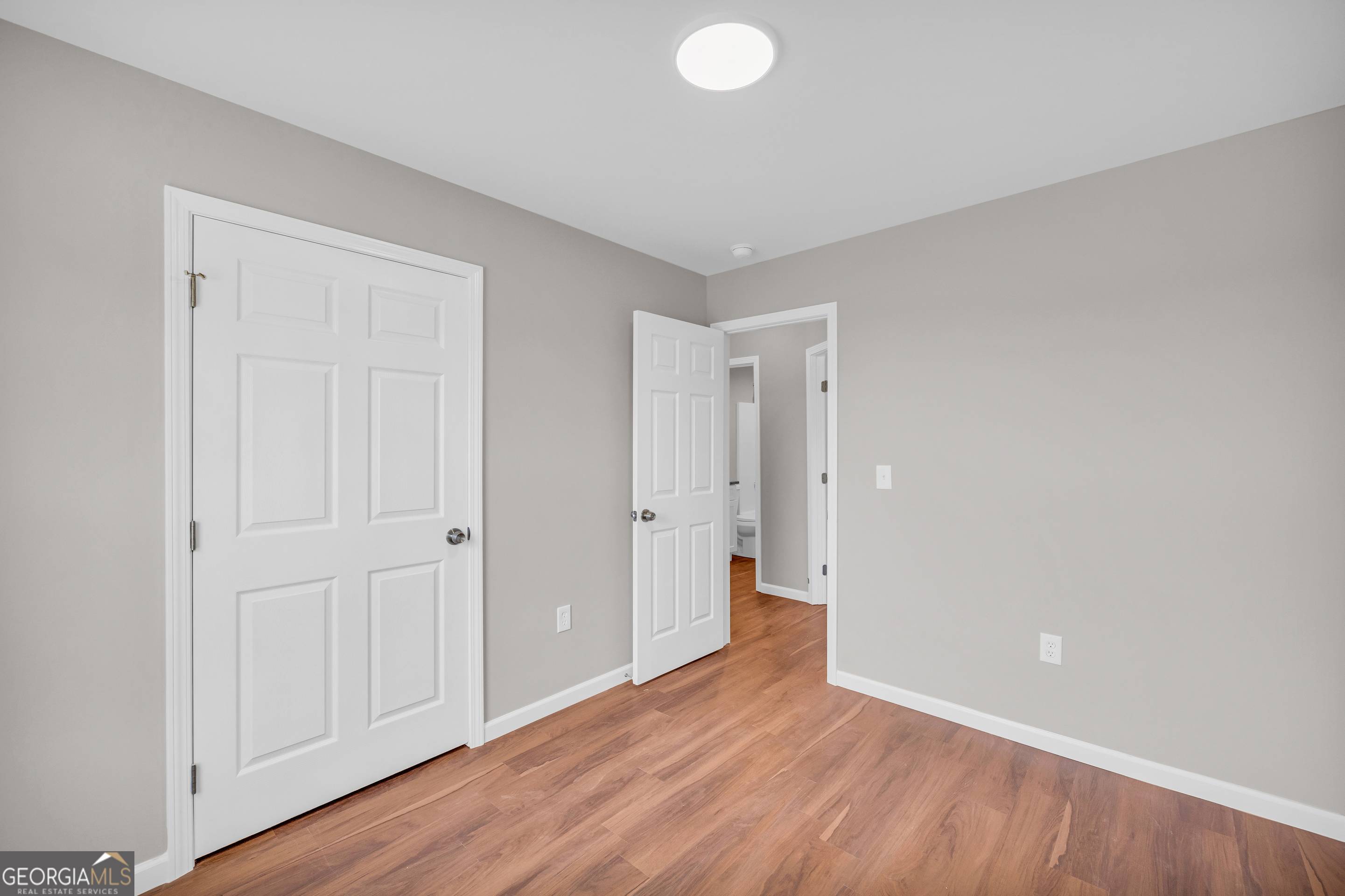 143 ADALINE Court Carnesville, GA 30521 - Photo 10 of 19 a view of an empty room and wooden floor