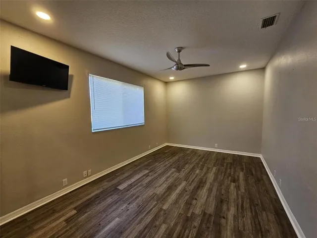 a bathroom with a shower and a sink