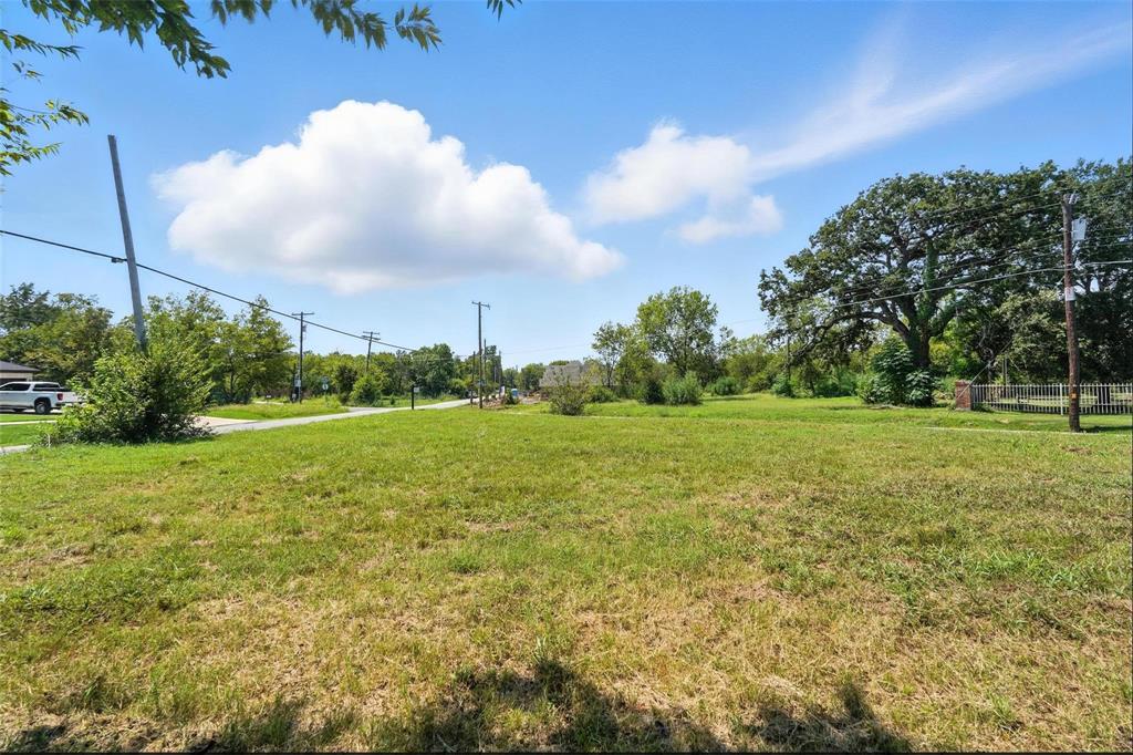 0 Mineral Wells Street Terrell, TX 75160 - Photo 8 of 10 a view of a green field with wooden fence