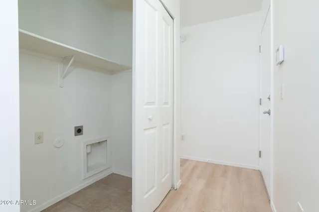 a bedroom with a bed and closet