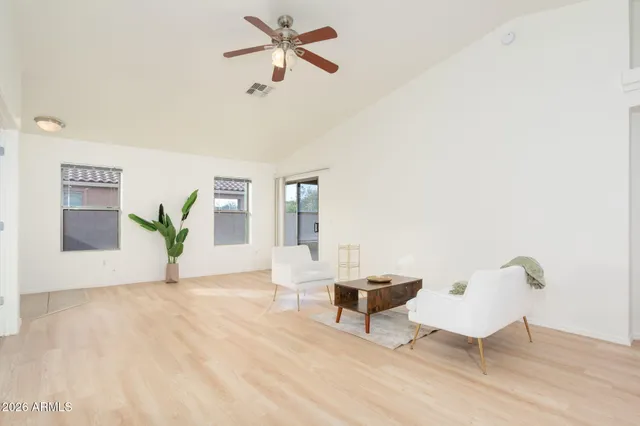 a view of a livingroom with furniture and a potted plant