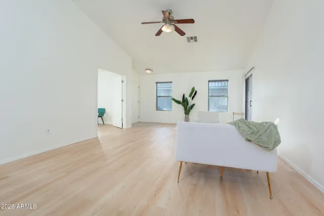 a kitchen with stainless steel appliances granite countertop a refrigerator and a stove