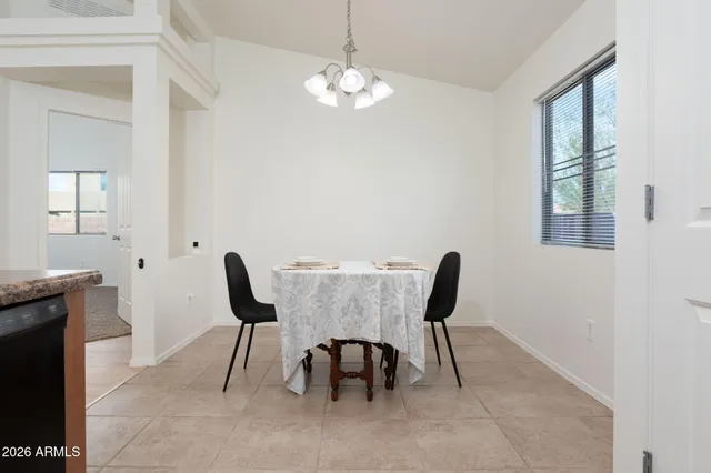 a bedroom with a bed and a table