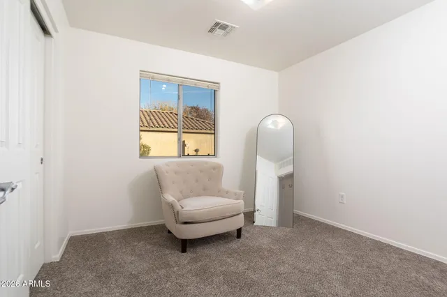 a bathroom with a granite countertop sink a toilet and shower