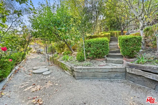 a view of statue in a garden