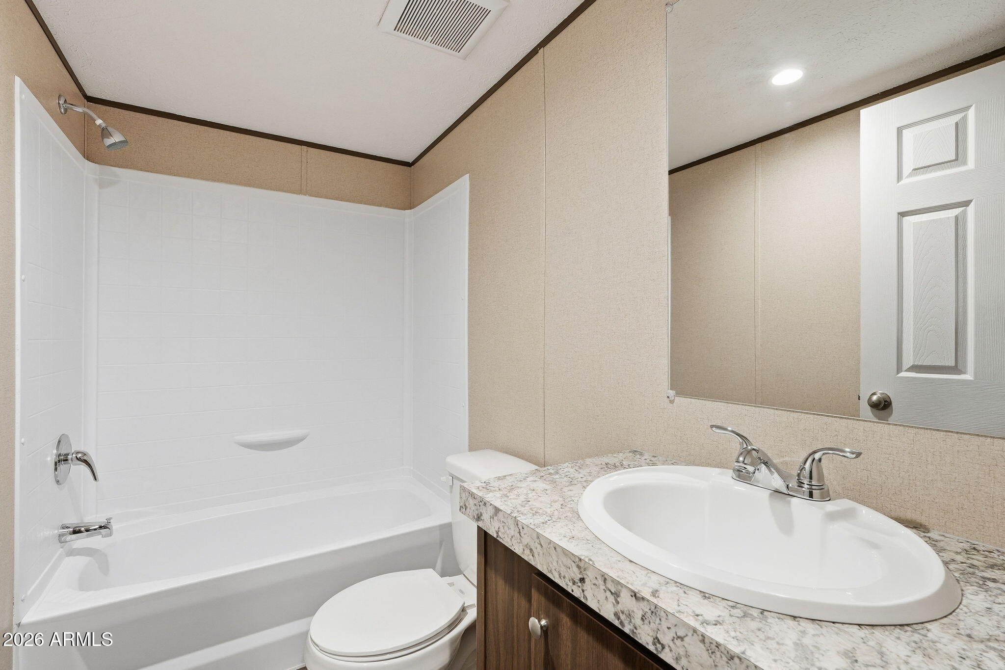 10567 North Dogwood Road Florence, AZ 85132 - Photo 22 of 28 a bathroom with a granite countertop sink and a mirror