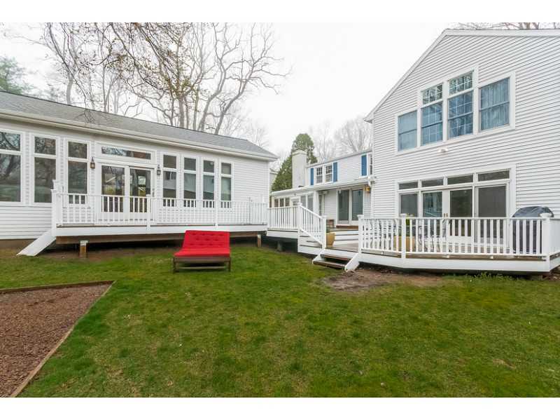 4 Memory Lane Rowayton, CT 06853 - Photo 21 of 25 a backyard of a house with a deck table and chairs