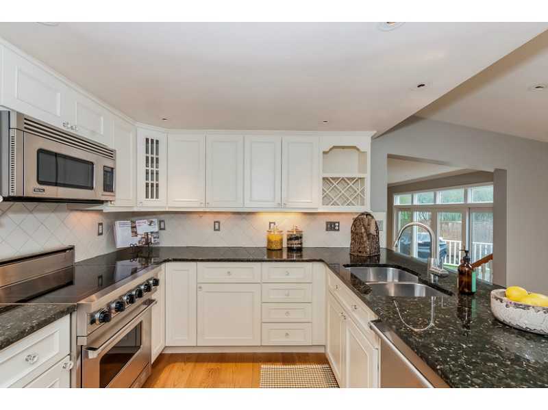 4 Memory Lane Rowayton, CT 06853 - Photo 8 of 25 a kitchen with granite countertop a sink stainless steel appliances and cabinets