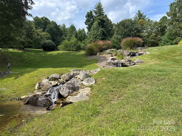 a backyard of a house with lots of green space