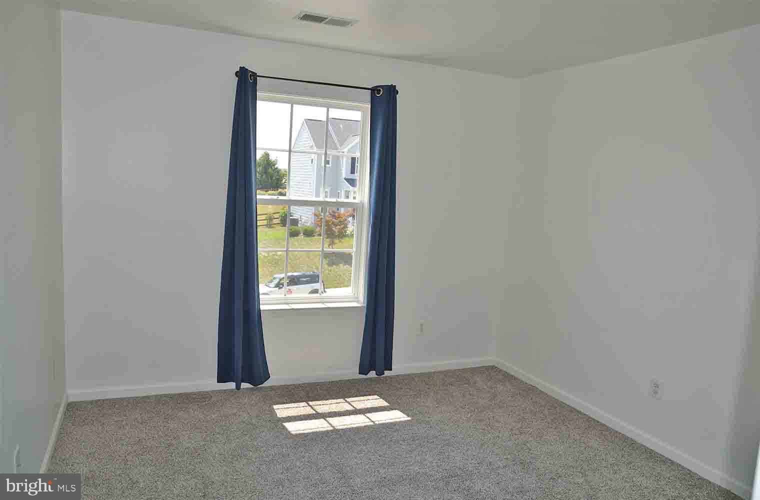 167 Bouldin Road Charles Town, WV 25414 - Photo 15 of 30 an empty room with windows