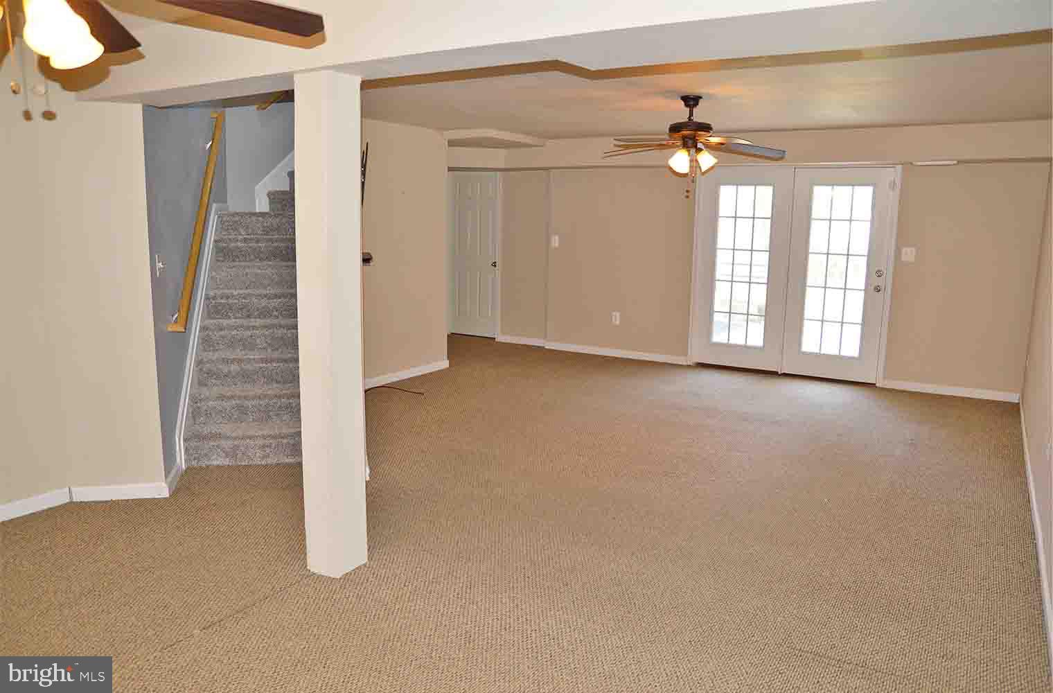 167 Bouldin Road Charles Town, WV 25414 - Photo 18 of 30 wooden floor in an empty room with a window