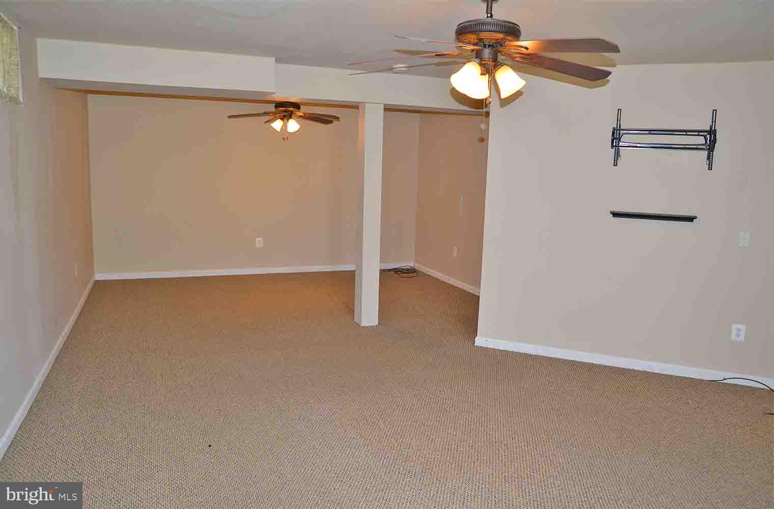 167 Bouldin Road Charles Town, WV 25414 - Photo 19 of 30 a view of a chandelier fan and wooden floor
