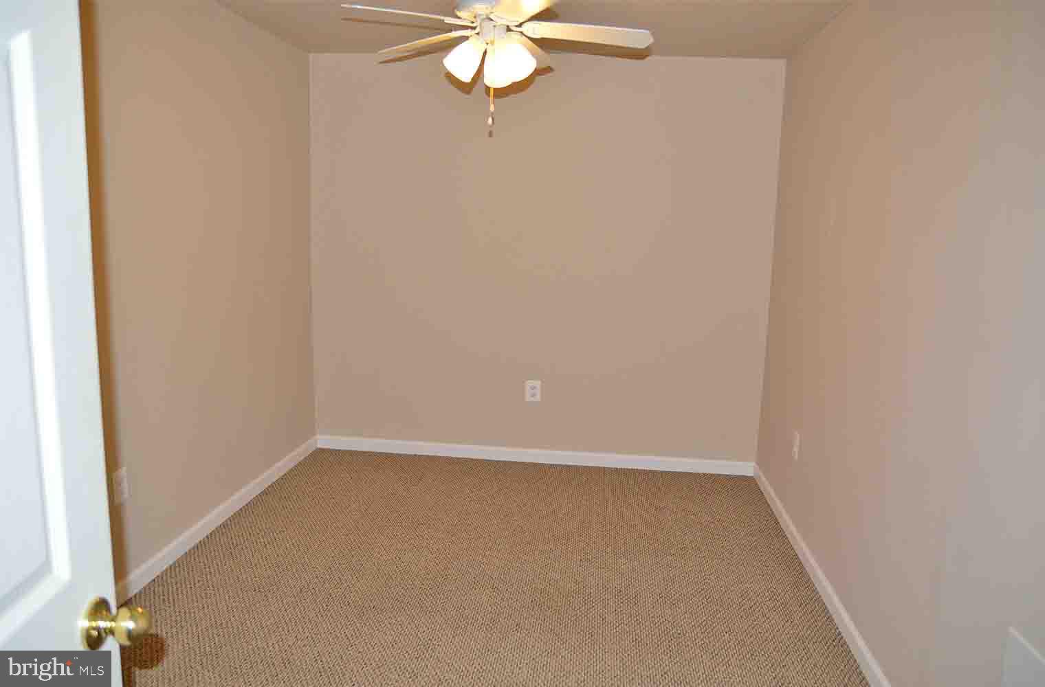 167 Bouldin Road Charles Town, WV 25414 - Photo 21 of 30 an empty room with a chandelier fan
