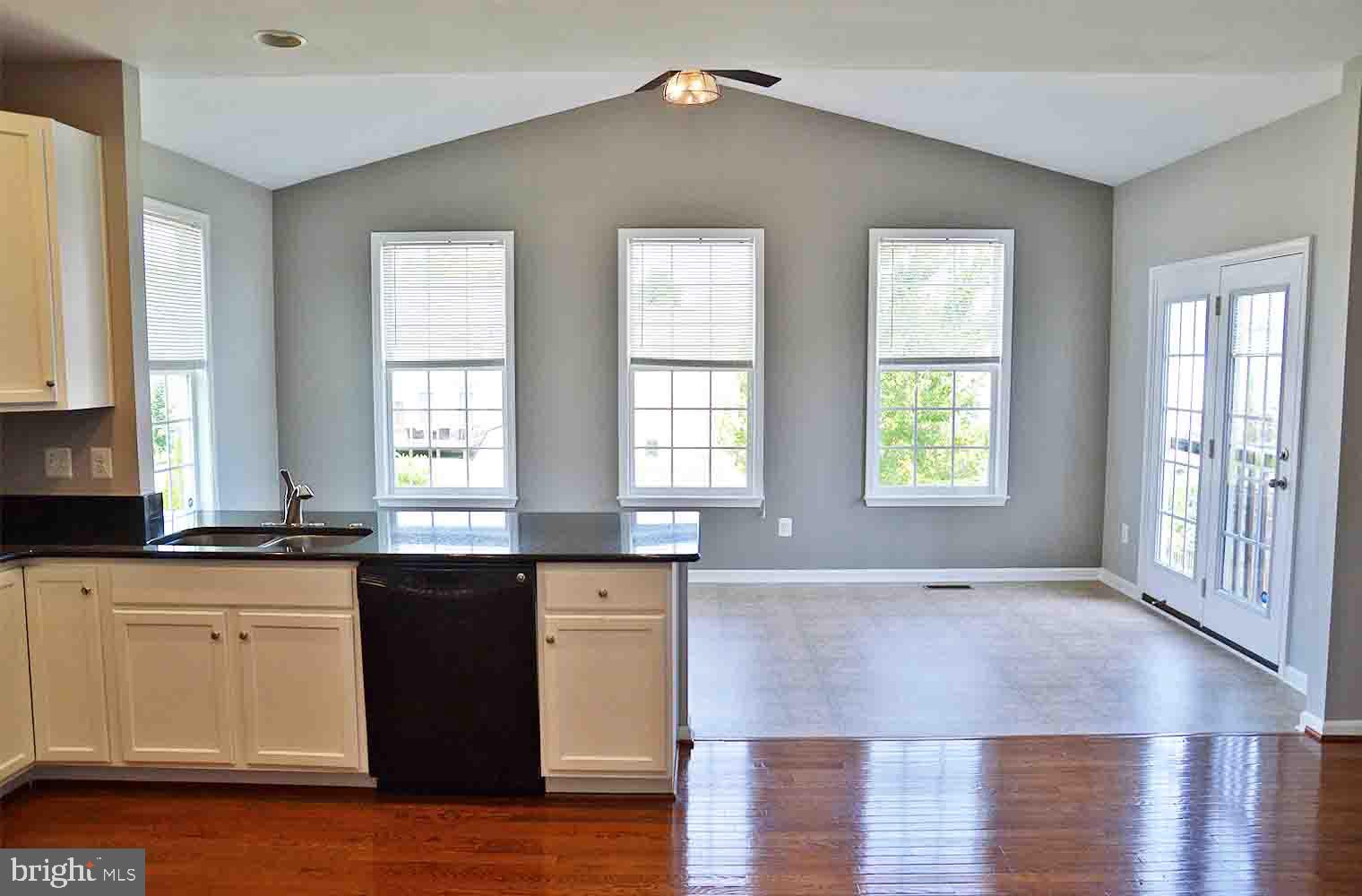 167 Bouldin Road Charles Town, WV 25414 - Photo 5 of 30 a view of a kitchen with granite countertop a sink cabinets and wooden floor