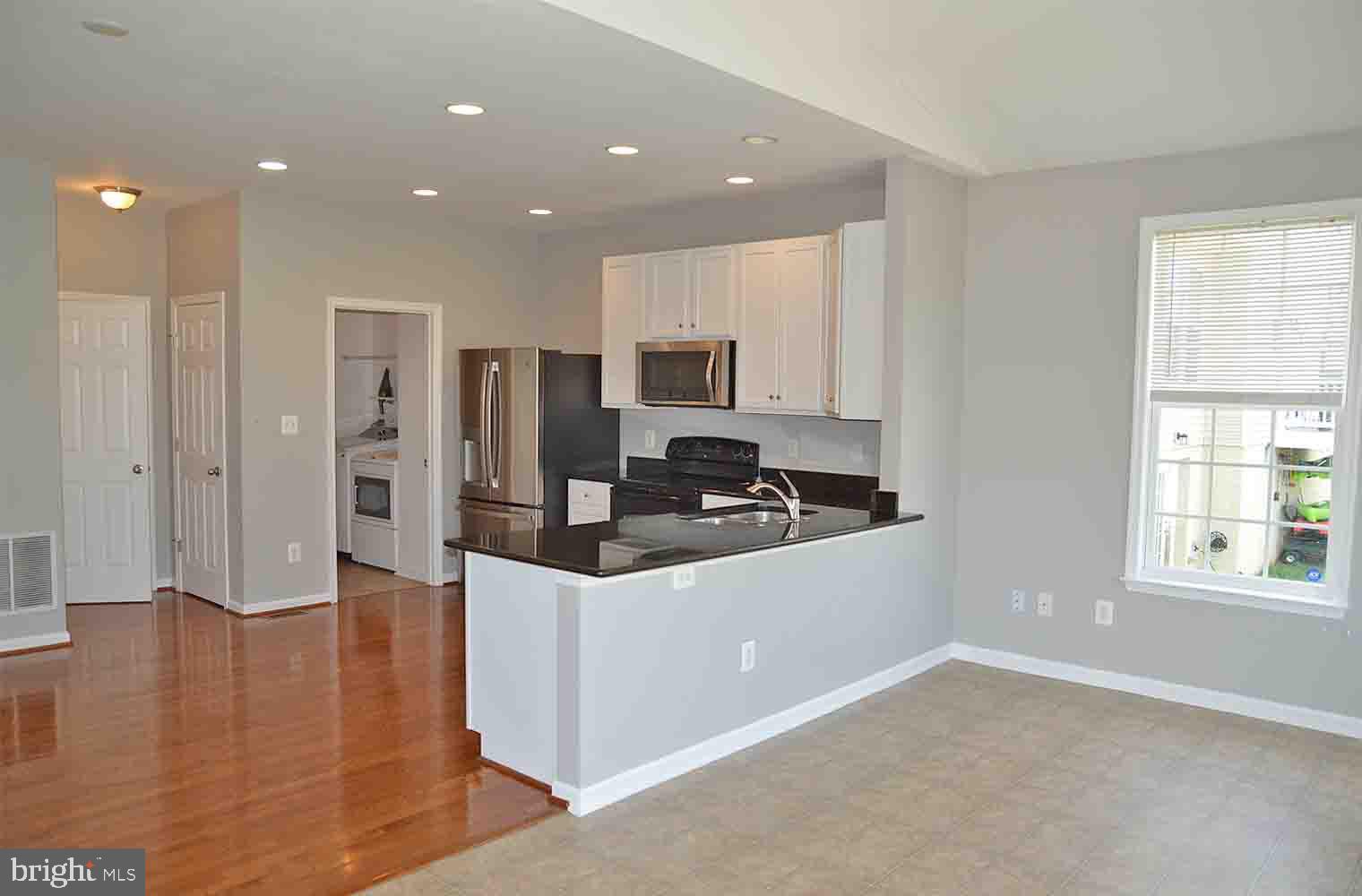 167 Bouldin Road Charles Town, WV 25414 - Photo 6 of 30 a kitchen with stainless steel appliances granite countertop a stove and a refrigerator