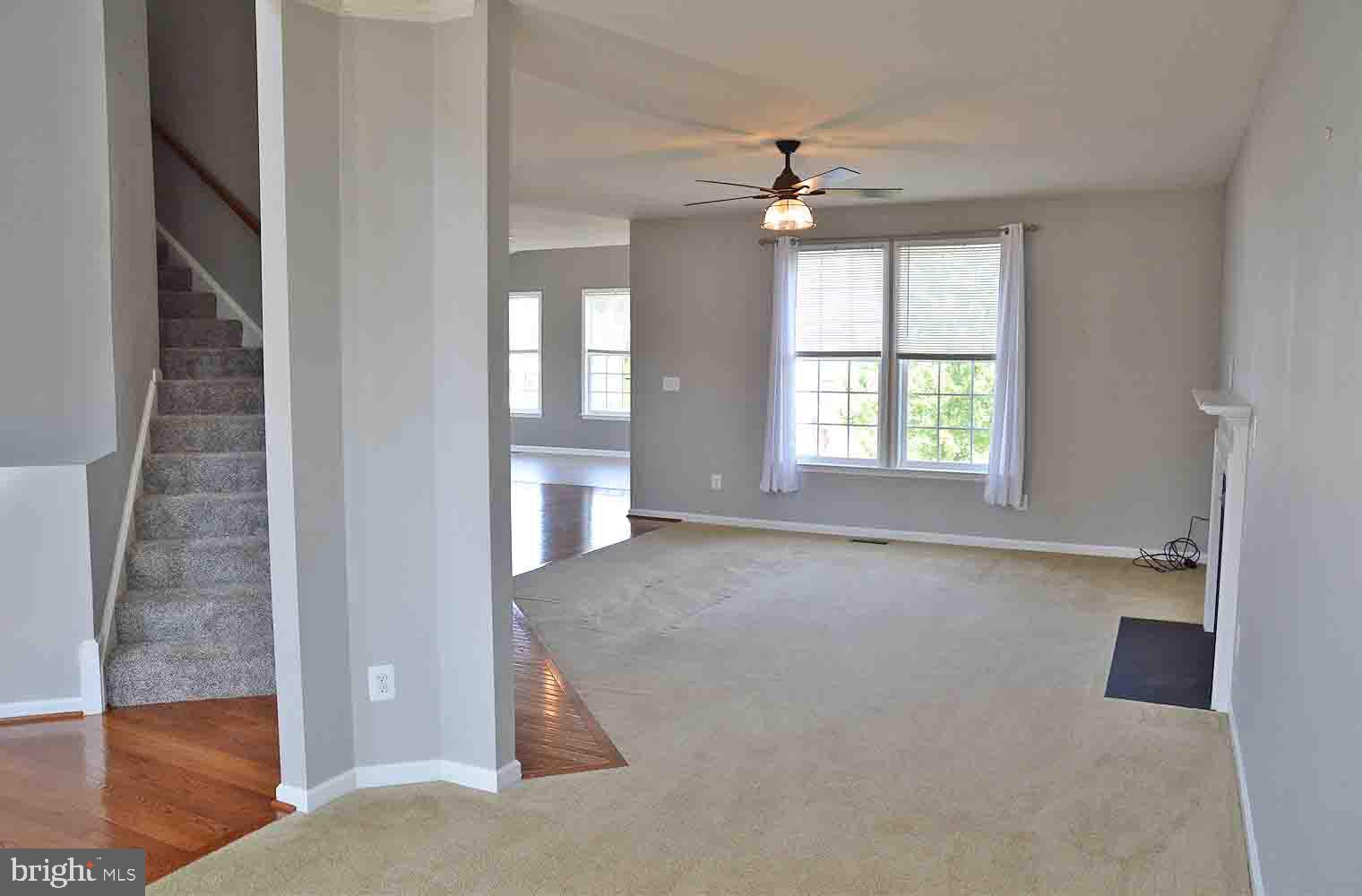 167 Bouldin Road Charles Town, WV 25414 - Photo 9 of 30 an empty room with windows and cabinet