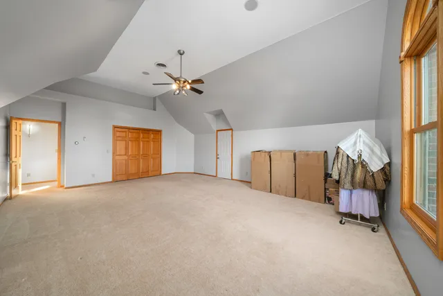 an empty room with windows and entryway