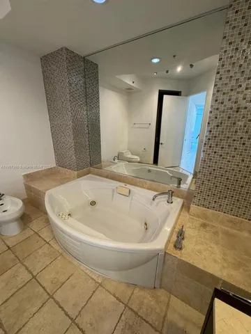 a bathroom with a bathtub and a sink