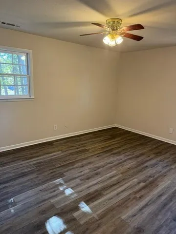 a view of wooden floor in an empty room