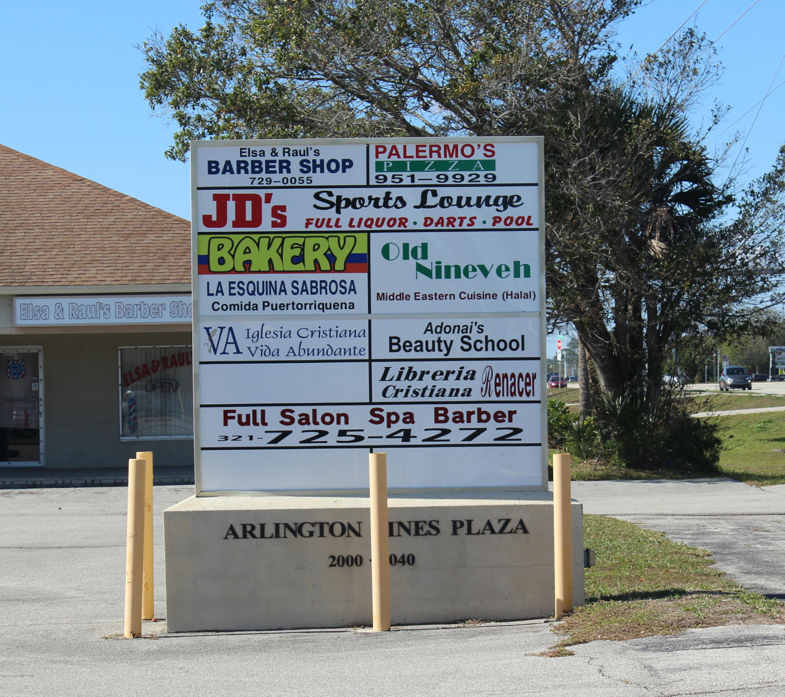 2020 Palm Bay Road Northeast, Unit 6 Palm Bay, FL 32905 - Photo 10 of 10 a sign on the side of a building