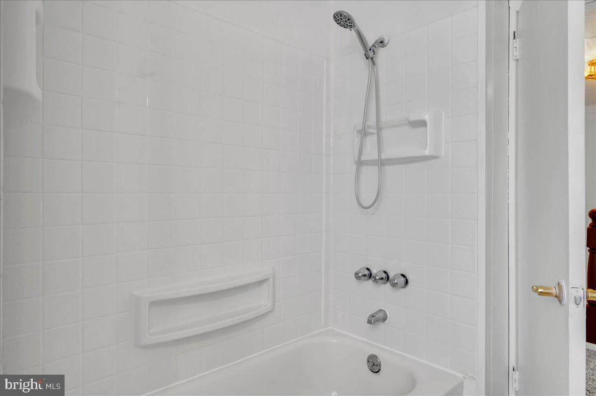 208 8th Street Brookhaven, PA 19015 - Photo 15 of 31 a bathroom with a bath tub with a shower