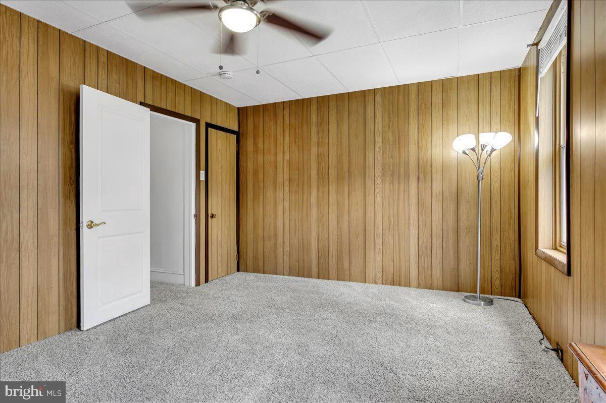 208 8th Street Brookhaven, PA 19015 - Photo 21 of 31 a view of a interior in a hall with a chandelier fan