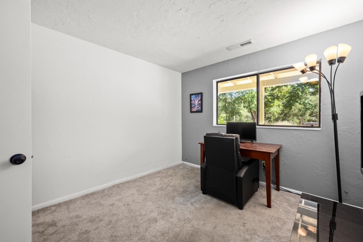 2162 Painted Pony Road Somerset, CA 95684 - Photo 44 of 65 a living room with furniture and a window