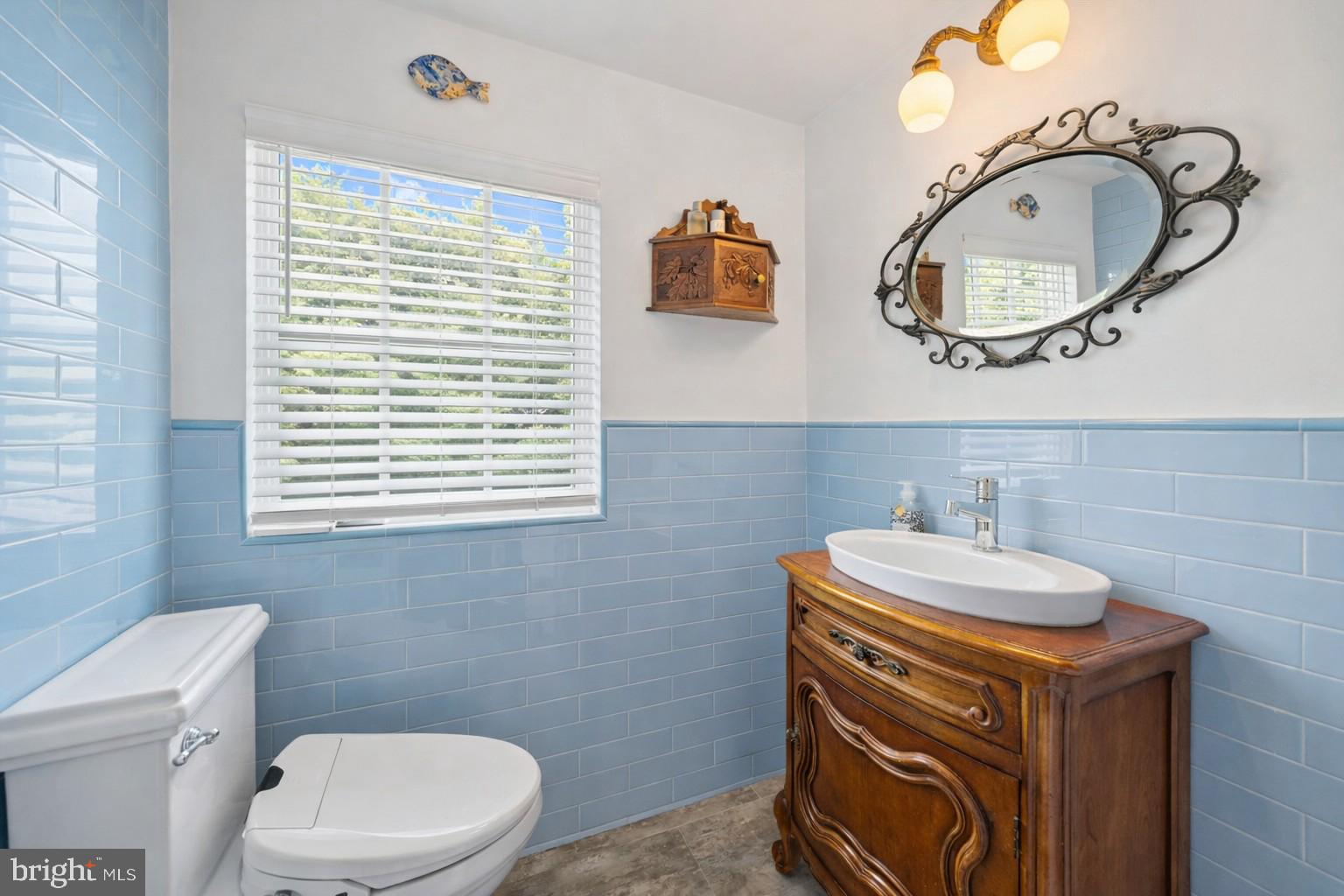 9919 Old Georgetown Road Bethesda, MD 20814 - Photo 16 of 34 Bright bathroom with walk‑in shower.