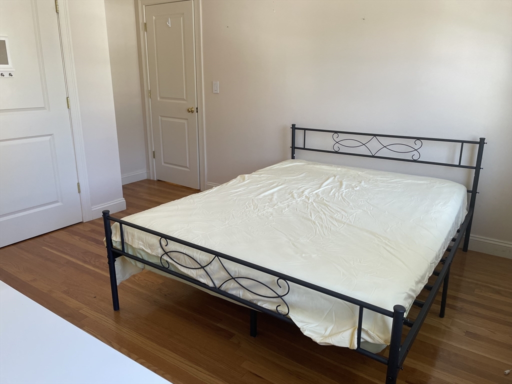 220 Grove Street, Unit 1 Waltham, MA 02453 - Photo 23 of 34 a close view of a room with wooden floor