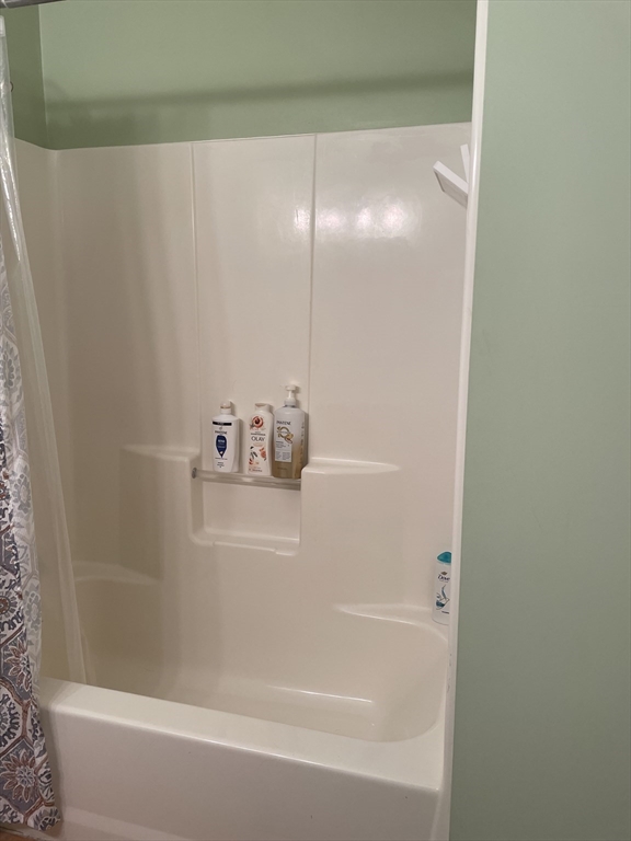 220 Grove Street, Unit 1 Waltham, MA 02453 - Photo 33 of 34 a close up of a bathtub