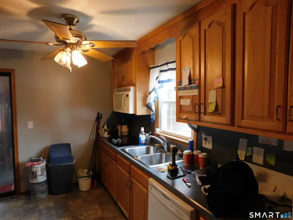 a kitchen with sink cabinets and a window