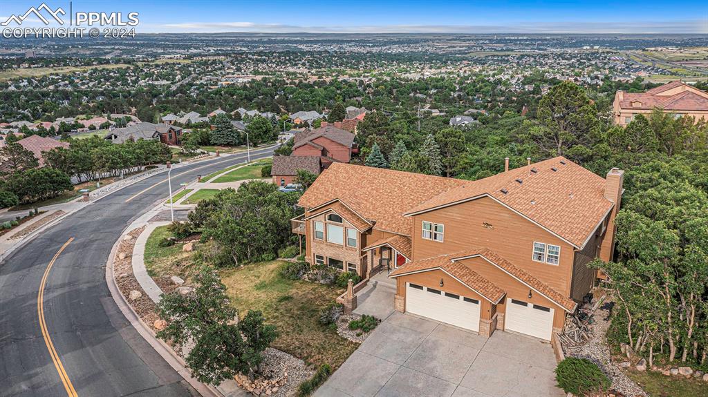 an aerial view of a house with a garden