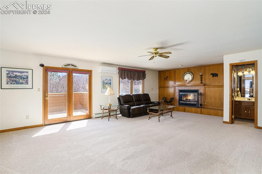 4315 Star Ranch Road Colorado Springs, CO 80906 - Photo 15 of 47 a living room with furniture and a fireplace