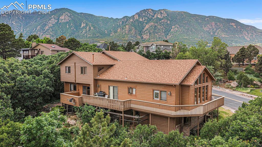 4315 Star Ranch Road Colorado Springs, CO 80906 - Photo 2 of 47 a aerial view of a house next to a mountain