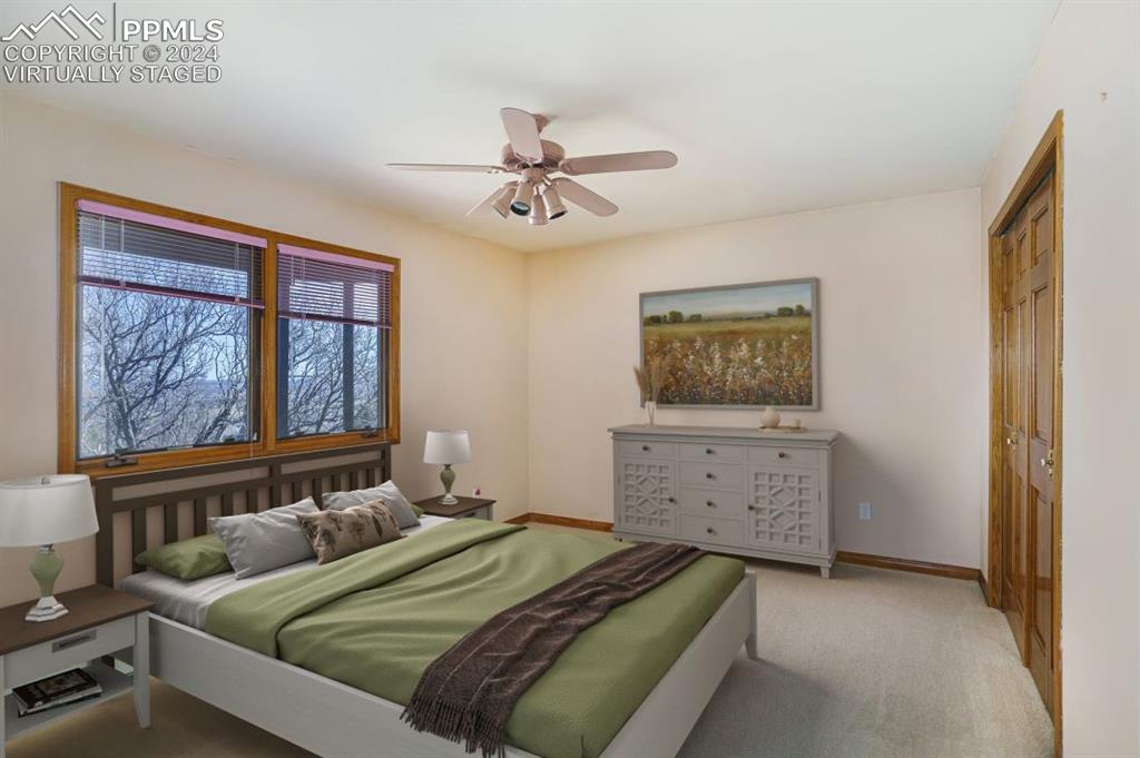 4315 Star Ranch Road Colorado Springs, CO 80906 - Photo 26 of 47 a bedroom with a bed and a window