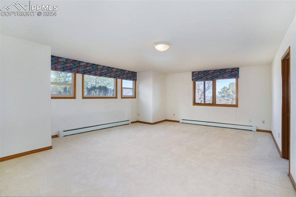 4315 Star Ranch Road Colorado Springs, CO 80906 - Photo 32 of 47 an empty room with windows