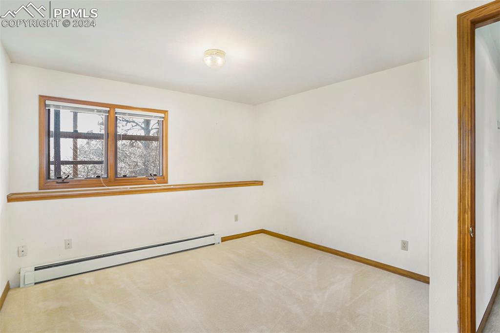 4315 Star Ranch Road Colorado Springs, CO 80906 - Photo 35 of 47 an empty room with a window