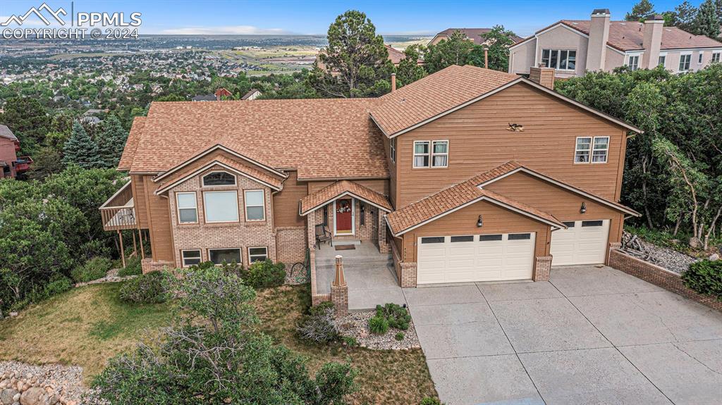 4315 Star Ranch Road Colorado Springs, CO 80906 - Photo 37 of 47 a front view of a house with a yard