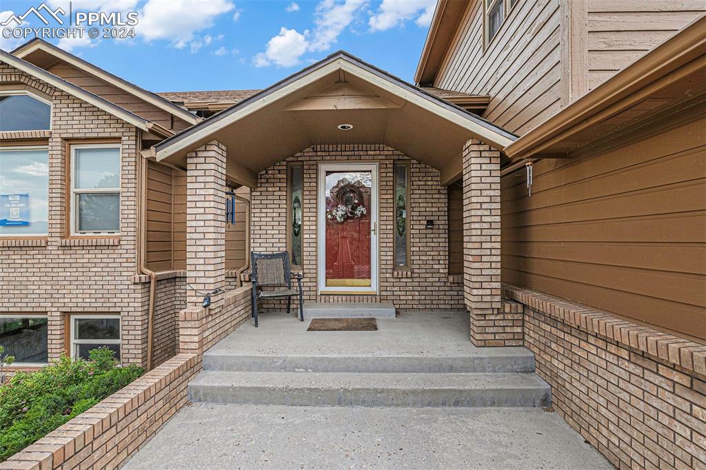 4315 Star Ranch Road Colorado Springs, CO 80906 - Photo 40 of 47 a front view of a house with a white door