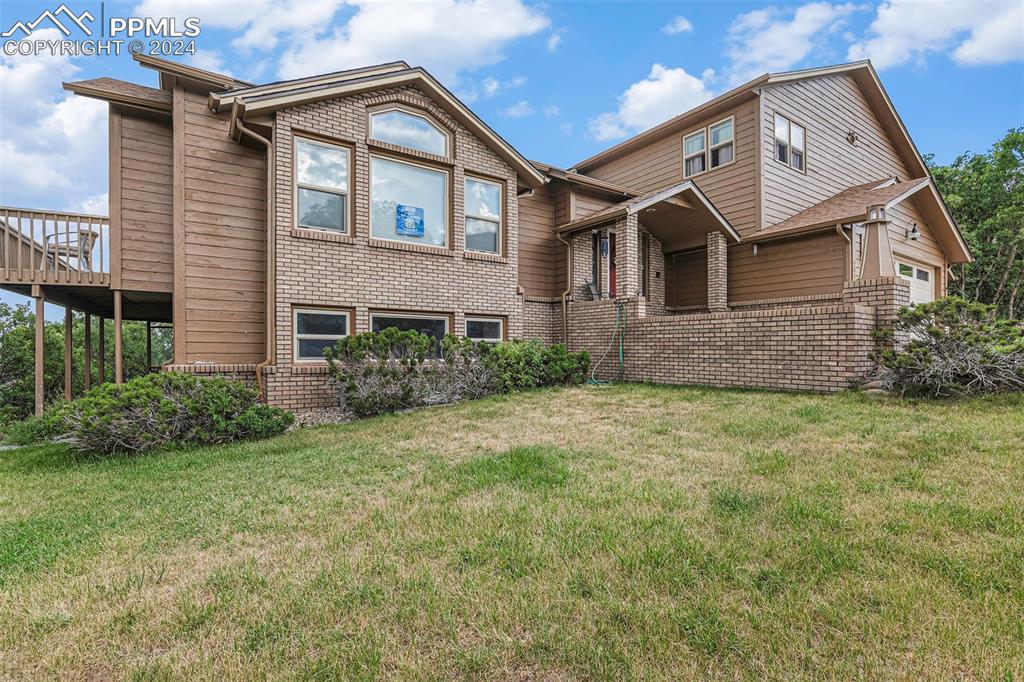 4315 Star Ranch Road Colorado Springs, CO 80906 - Photo 47 of 47 a front view of a house with garden